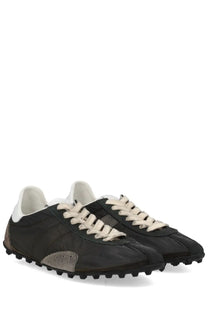 Maison Margiela women’s sneaker sprinters black and beige low-top with rugged textured upper and chunky rubber sole