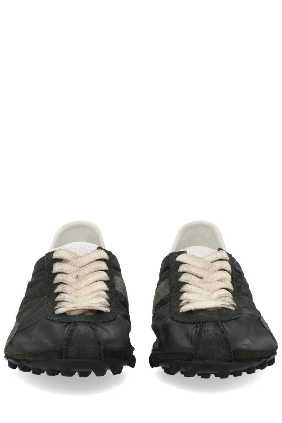 Maison Margiela women’s sneaker sprinters in black leather with cream laces and rugged textured sole