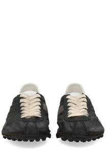 Maison Margiela women’s sneaker sprinters in black leather with cream laces and rugged textured sole
