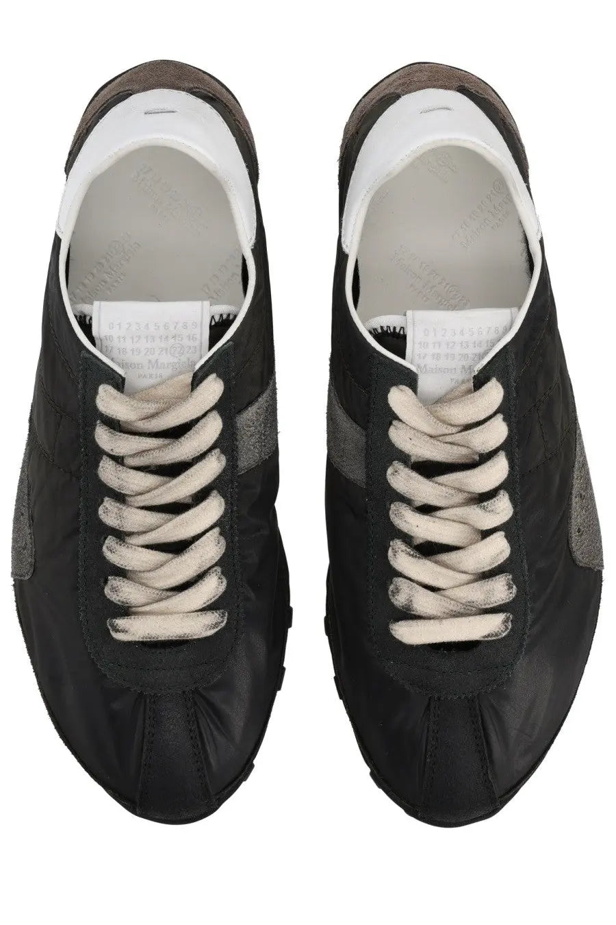 Maison Margiela women’s sneaker sprinters in black suede and nylon with gray accents white laces minimalist design