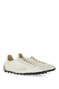 Maison Margiela women’s sneaker sprinters in cream-colored leather with black rubber soles and laces minimalist design