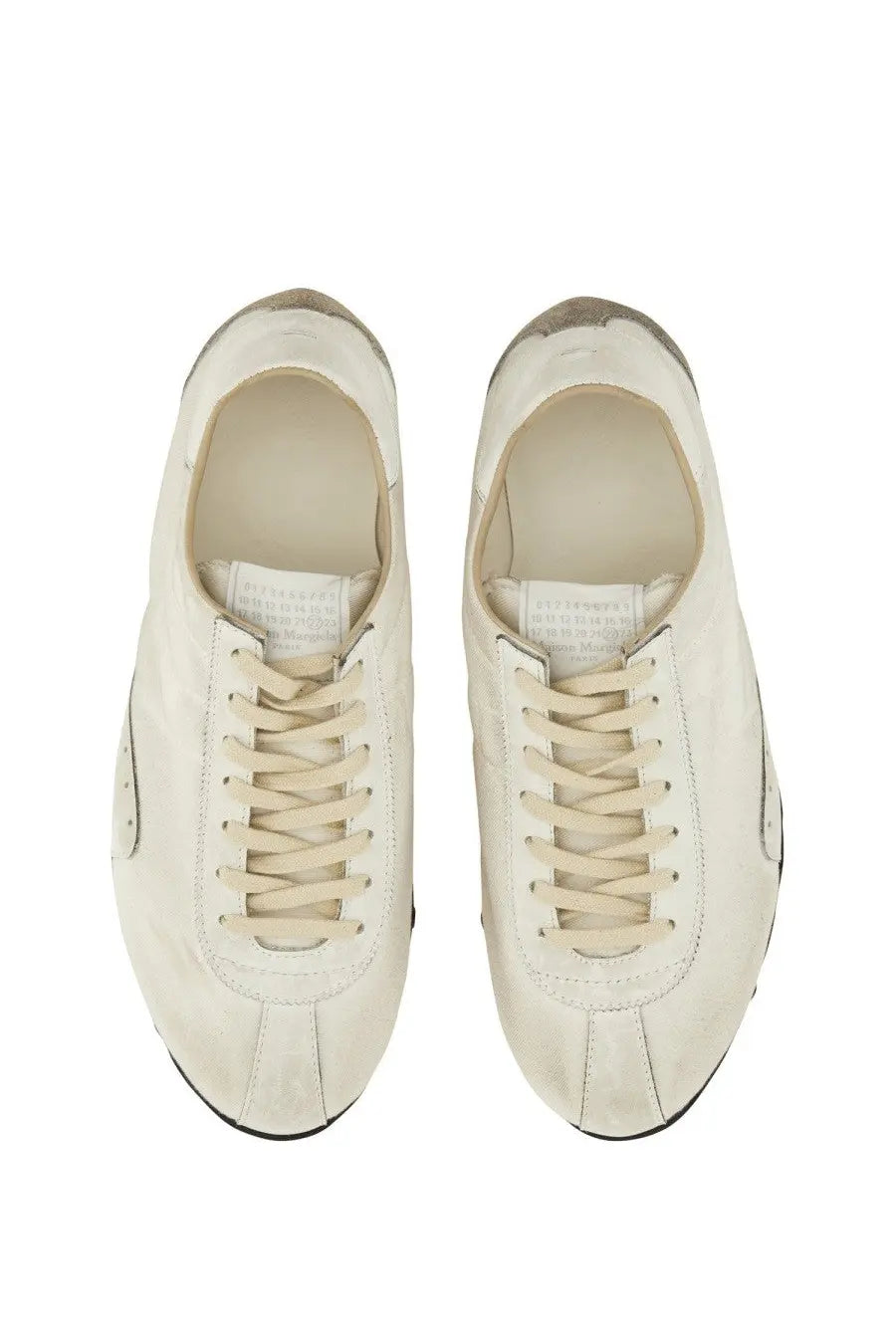Maison Margiela women’s sneaker sprinters in cream-colored suede with distressed finish and black rubber soles