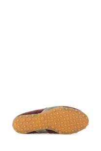 Maison Margiela women’s sprinters low top sneaker in maroon and gray textured material with tan rubber sole and circular studs