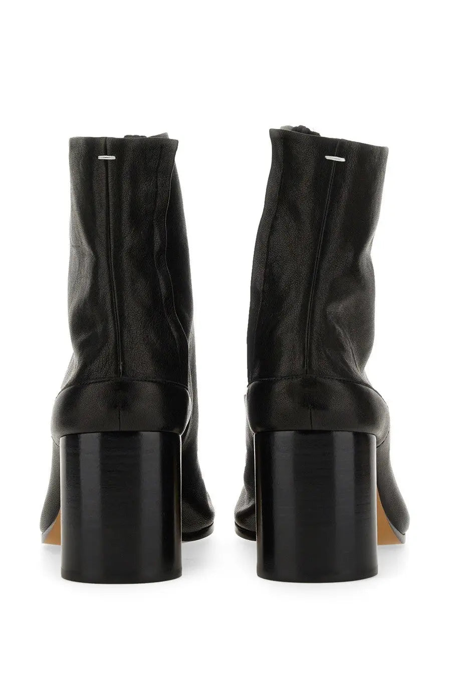 Back view of Maison Margiela women’s Stivale Tabi black leather ankle boots with glossy block heel and silver zipper detail