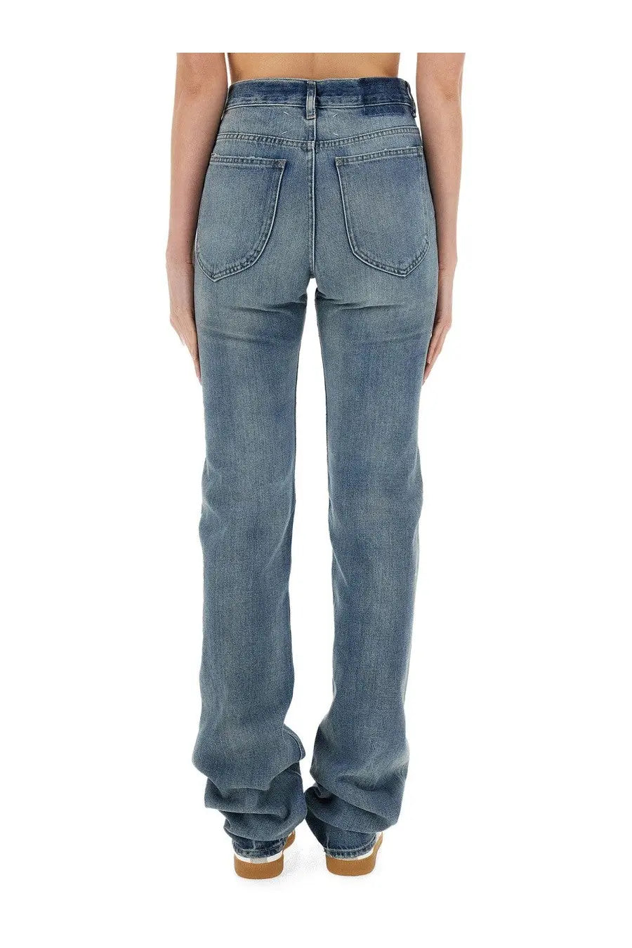 Maison Margiela women’s blue denim jeans with straight-leg cut shown from the back with classic pockets