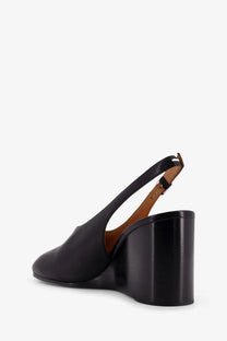 Maison Margiela women’s black leather slingback tabi pump with chunky block heel and tan interior lining