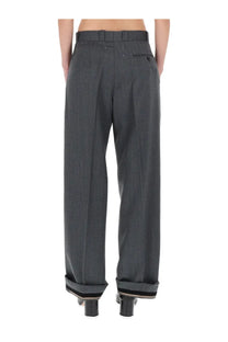 Maison Margiela women’s tailored grey trousers in dark gray textured wool with rolled cuffs and subtle stitching details