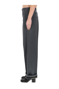 Maison Margiela women’s tailored dark gray wide-leg trousers with subtle textured weave and rolled cuffs with black and gray stripes