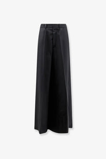 Maison Margiela women’s black virgin wool wide-leg trousers with minimalist design and subtle pleats