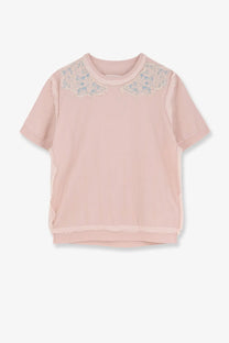 A soft pink short-sleeved top with delicate lace detailing across the shoulders from maison margiela