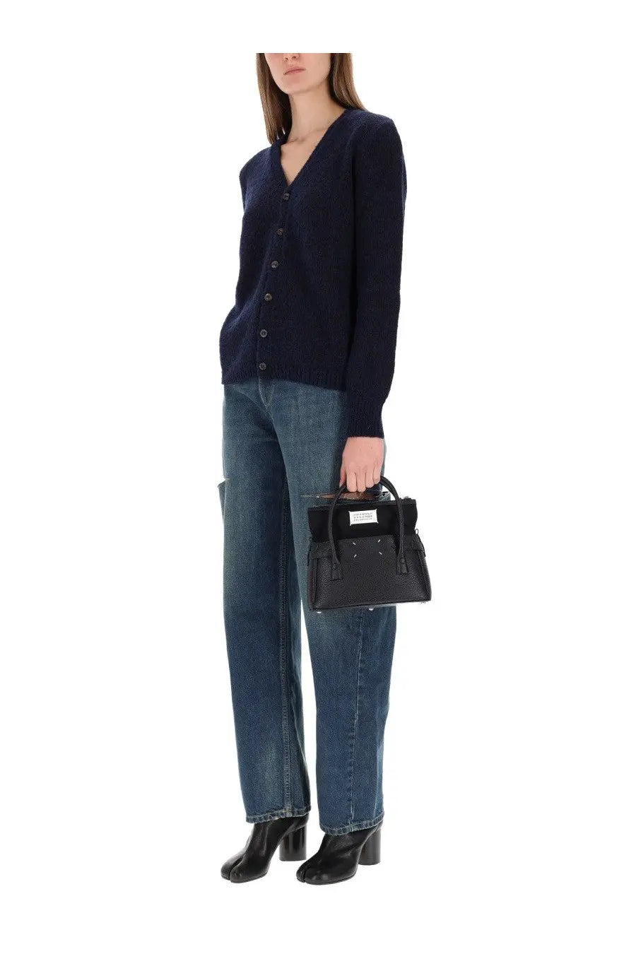 Black leather mini handbag with top handle and front flap closure paired with Maison Margiela blue wool cardigan