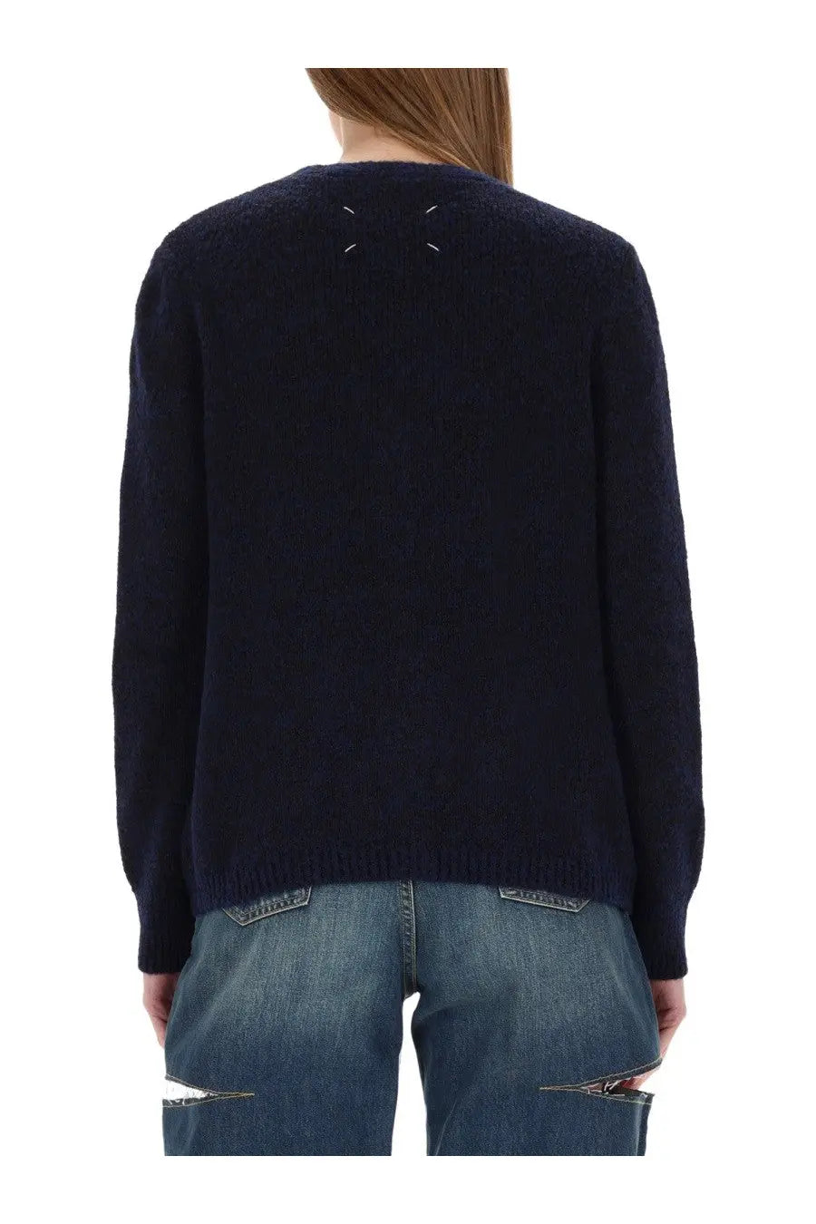 Dark navy wool cardigan by maison margiela with textured weave and white x-shaped stitching at the back neckline