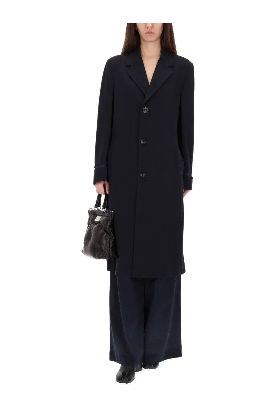 Maison Margiela women’s black woolen overcoat with notched lapels and three dark buttons for winter wear