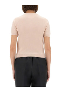 Maison margiela women’s wool crew neck shirt blue shown as soft blush pink short-sleeved knit top with ribbed neckline and hem