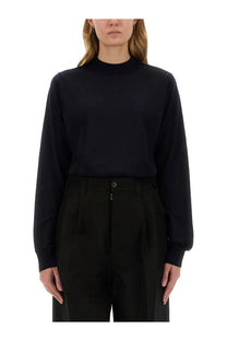 Black long-sleeved turtleneck top with smooth fitted silhouette in wool jersey by Maison Margiela women’s blue collection