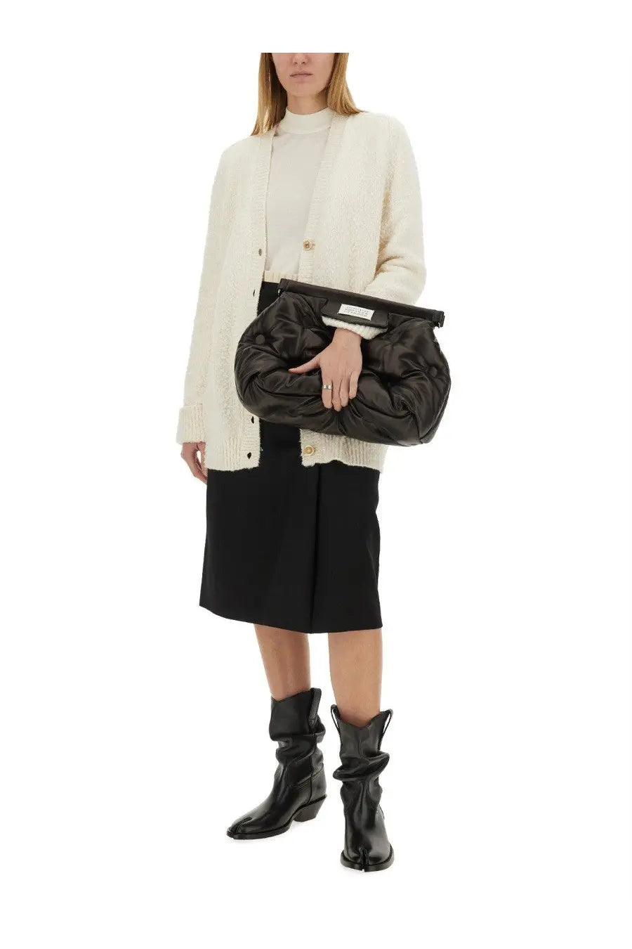 Black quilted clutch with a structured top flap and gold tone hardware paired with maison margiela wool jersey white