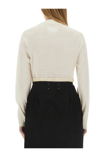 Maison Margiela women’s cream wool jersey blouse with long sleeves ruched waistband and minimalist stitching details