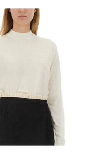 Maison Margiela women’s cream-colored wool jersey long-sleeved top with high neckline and ruched waistband