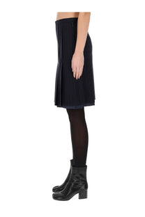 Maison Margiela women’s black wool midi skirt with tailored pleats and subtle side zipper detail