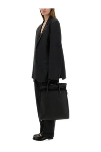 Black textured leather briefcase with top handle and front flap closure for Maison Margiela women’s wool and mohair pants black product