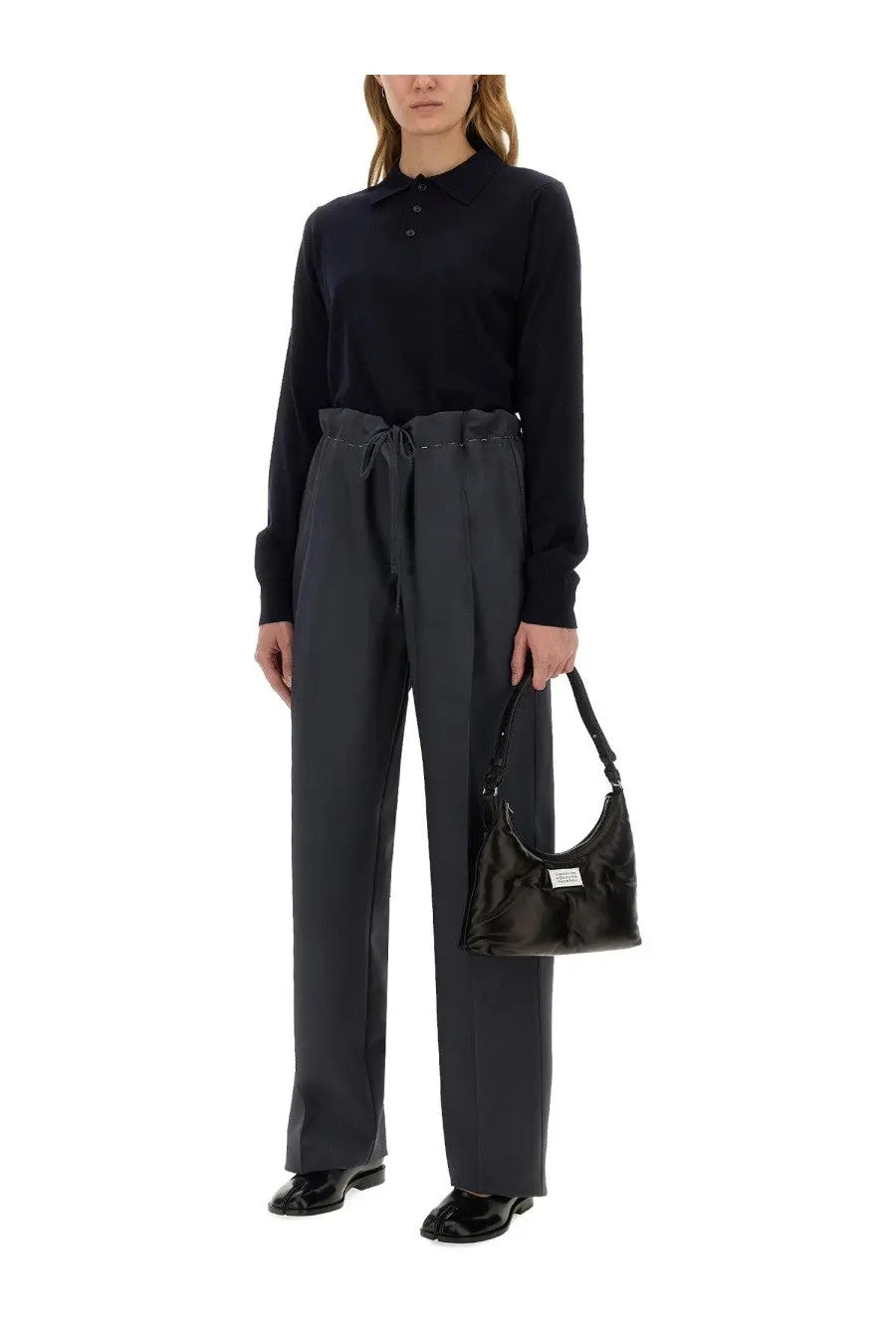 Black glossy leather hobo bag with white label on front featured with Maison Margiela women’s wool polo blue product