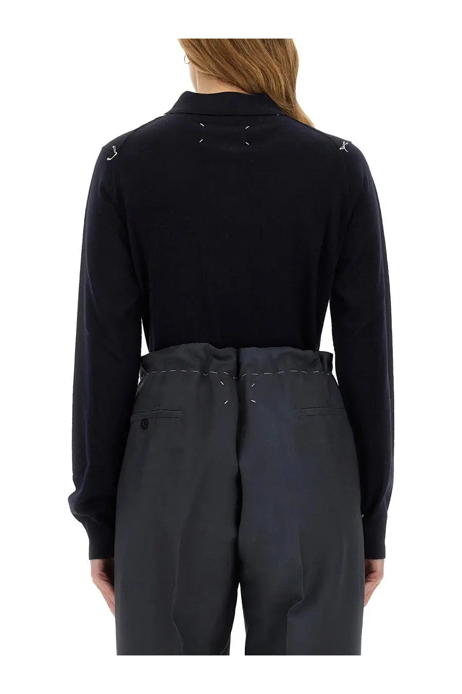 Maison Margiela women’s wool polo blue shown from the back with black long sleeves and white stitching at shoulders and back