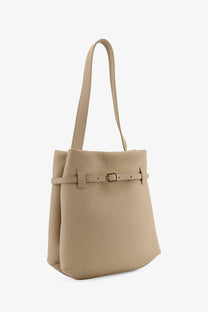 Beige leather mini bucket bag with matching strap and buckle detail from manu atelier tote du jour collection