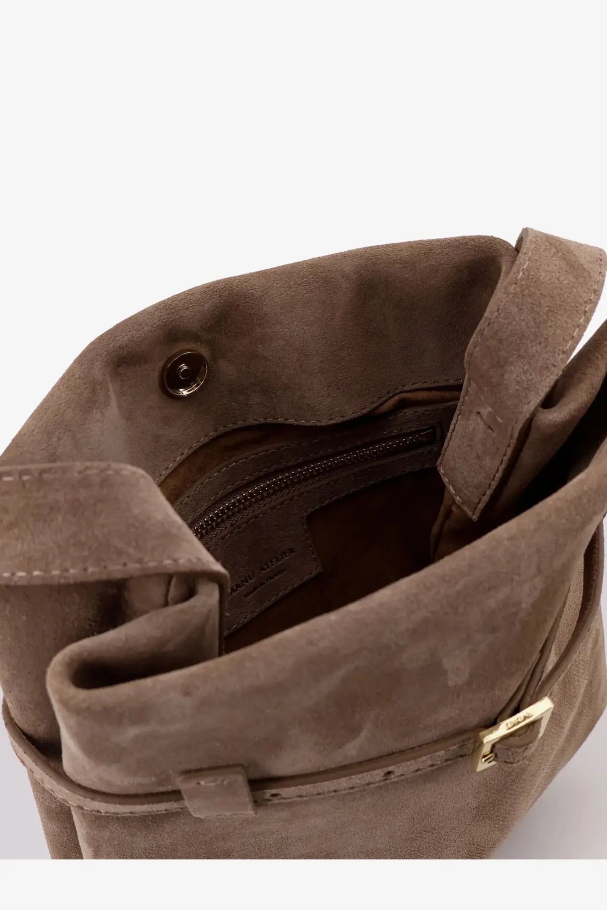 A taupe suede Manu Atelier women’s mini tote du jour shoulder bag with gold-tone buckle and zipper closure