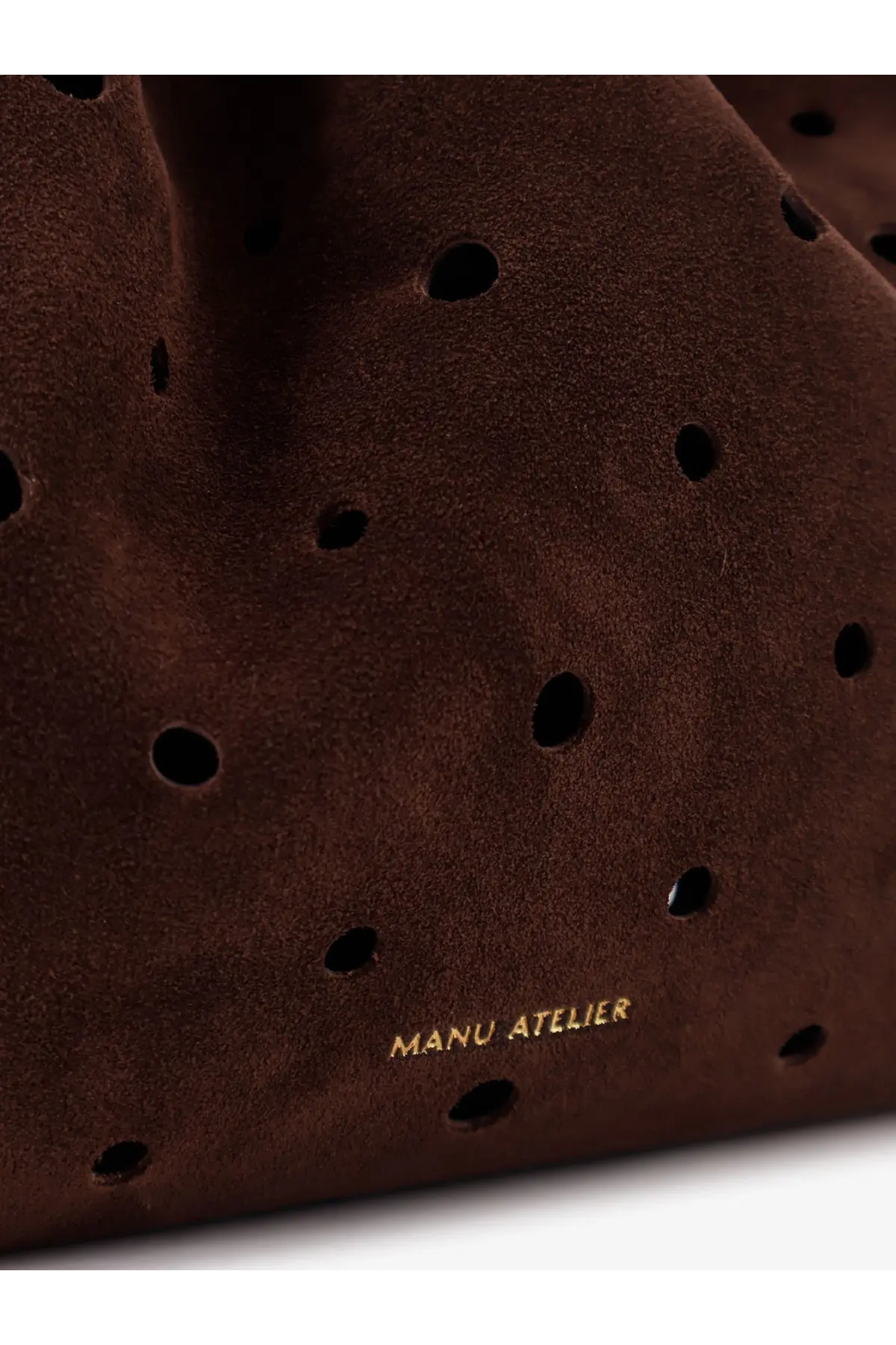 Manu Atelier women’s romy suede shoulder bag in brown with perforated design and gold-tone branding visible on front