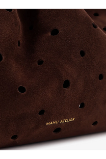 Manu Atelier women’s romy suede shoulder bag in brown with perforated design and gold-tone branding visible on front