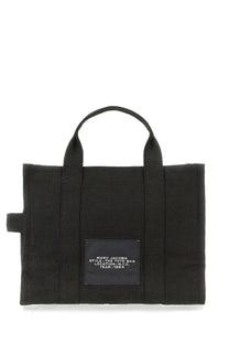 Black canvas marc jacobs women’s borsa the medium tote with a white text rectangular label patch