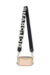 Beige rectangular Marc Jacobs women’s Borsa the Snapshot Brown camera bag with black strap and bold white smarc job lettering