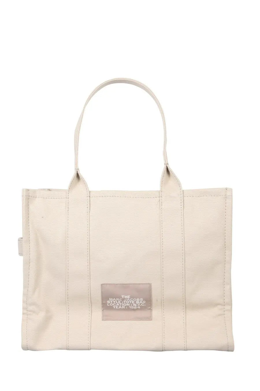 Marc Jacobs women’s borsa the tote large beige canvas bag with white handles and transparent label patch with black text