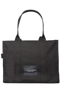 Marc Jacobs women’s borsa the tote large black fabric tote bag with a rectangular label patch on the front