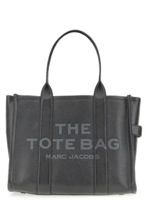 Black pebbled leather tote bag with embossed the tote bag marc jacobs logo from marc jacobs womens borsa the tote large black