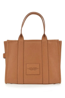 Tan leather marc jacobs tote bag with structured design and top handles for stylish everyday use