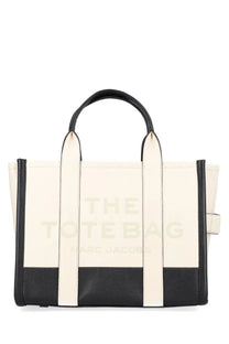 Cream and black leather Marc Jacobs women’s borsa tote medium featuring embossed the tote bag marc jacobs logo