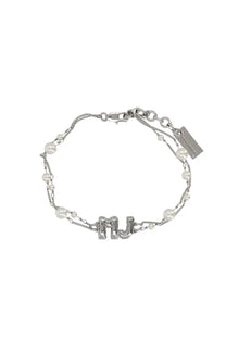 Silver-toned marc jacobs women’s bracelet with central mj initial charm accented by white pearls and delicate chain links