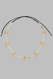Marc Jacobs women’s collana daisy multicolor black cord necklace with gold flower charms and white pale green beads