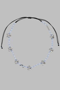 Marc Jacobs women’s collana daisy silver necklace with light blue translucent beads and silver flower charms on black cord