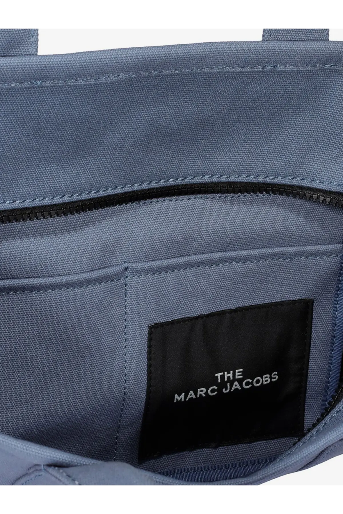 Marc Jacobs women’s the medium tote denim crossbody bag in navy blue woven fabric with black interior lining and branded label
