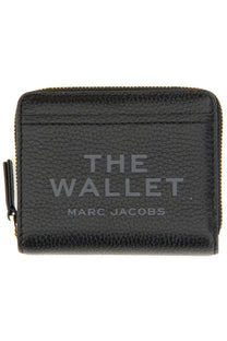 Black textured leather compact mini wallet for women by Marc Jacobs with embossed branding and gold-tone zipper