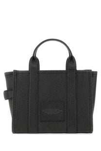 Marc Jacobs women’s the tote bag small black in black pebbled leather with structured handles and front patch pocket