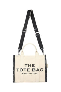 Marc Jacobs women’s the tote medium bag beige cream canvas tote bag with black handles and bold black text on front