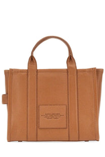 Tan leather marc jacobs the tote medium bag with top handles and front patch label in beige