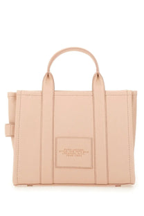 Beige leather marc jacobs tote bag with top handles and a front patch label for women in medium size