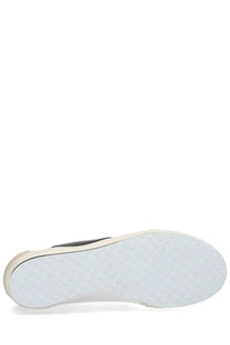 White rubber sole with textured dotted pattern and black stitching on the edge of marine serre women’s astra sneaker