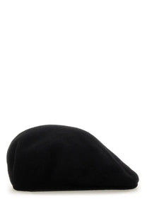 Black wool beret with a smooth textured surface and classic rounded crown by Marine Serre women’s cap black