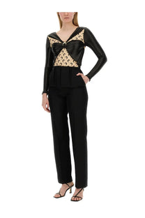 Marine Serre womens black long-sleeved draped bodysuit with beige bodice and black crescent moon motifs and bow accent