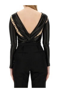 Back view of marine serre women’s black satin draped bodysuit with deep v-back and beige leopard-print shoulder panels